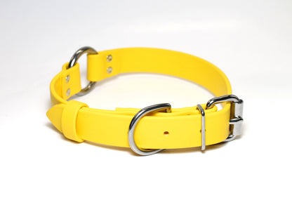 A bright yellow Biothane dog collar with silver-colored O-ring and buckle, displayed on a white background.